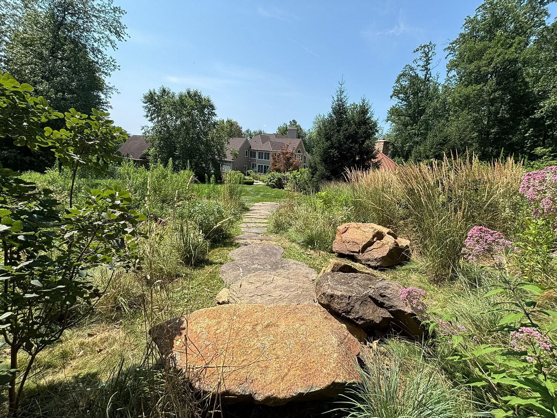 Boulder seating area overlooking the planted landscape